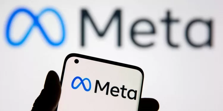 FILE PHOTO: A smartphone with Meta logo is seen in front of displayed Facebook's new rebrand logo Meta in this illustration taken, October 28, 2021. REUTERS/Dado Ruvic/Illustration/File Photo